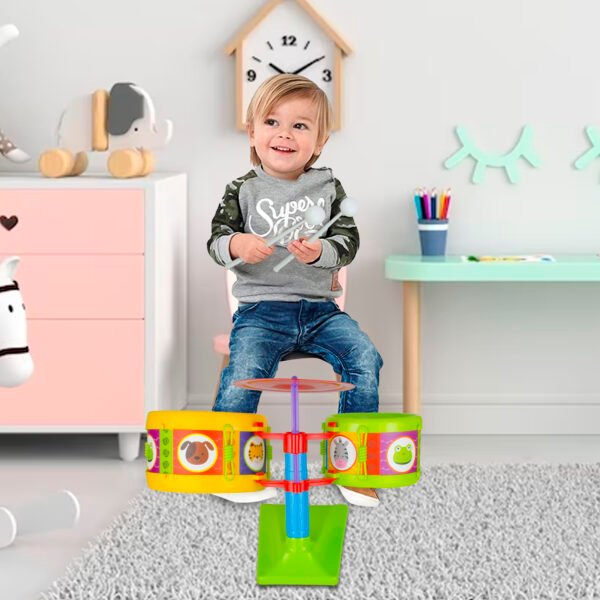 Musical drum set played by kid